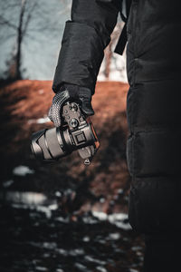Low section of man photographing