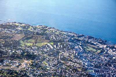 High angle view of cityscape by sea