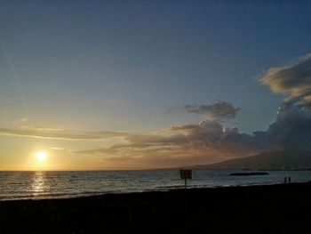 Scenic view of beach against sky during sunset