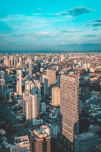 High angle view of modern buildings in city against sky