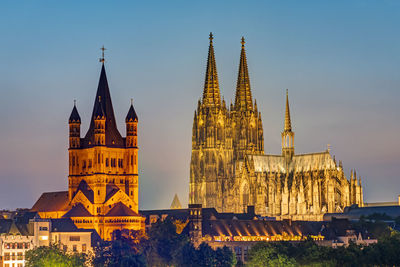 The famous cathedral and great st. martin church in cologne at dusk