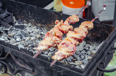 Close-up of meat on barbecue grill