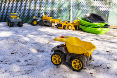 Toy car on field during winter