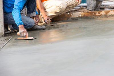 Low section of masons working at construction site