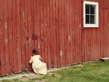 Portrait of young woman on brick wall