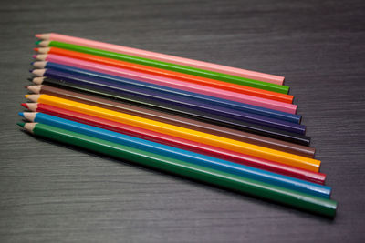 Close-up of colorful pencils on table