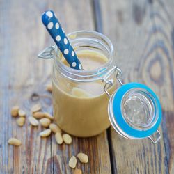 High angle view of peanut butter in jar on table