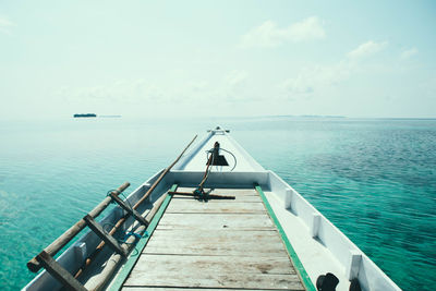 Pier on sea against sky