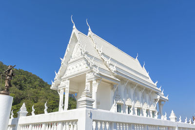 Low angle view of building against blue sky