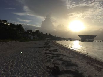 Scenic view of beach at sunset