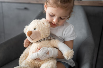 Cute baby girl with stuffed toy