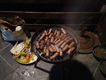 High angle view of meat cooking on barbecue