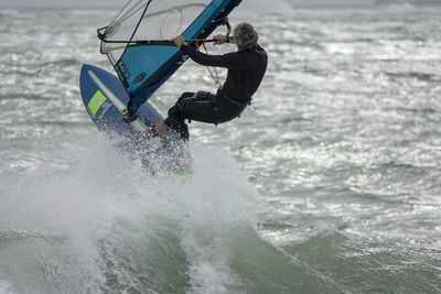 Man surfing in sea