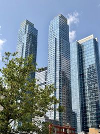 Low angle view of modern buildings against sky