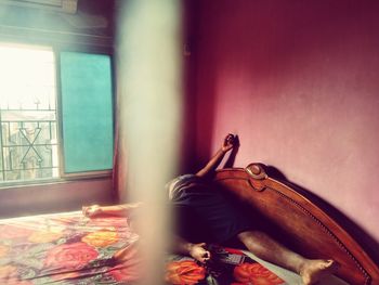 Woman relaxing on bed