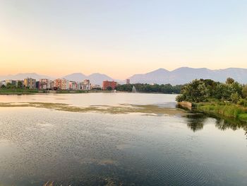 Scenic view of lake against sky during sunset