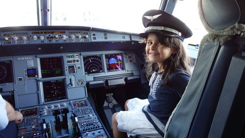 Woman looking through airplane window