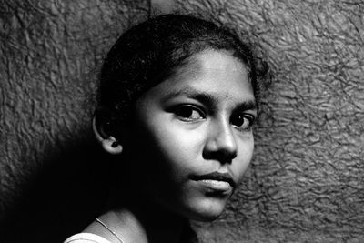 Close-up portrait of young man looking away