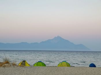 Scenic view of sea against clear sky during sunset