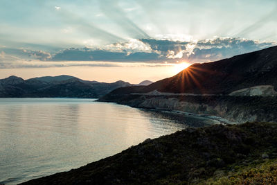 Scenic view of mountains against dramatic sky