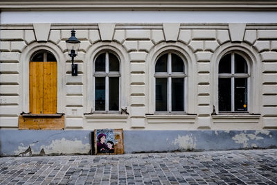 Man in front of building