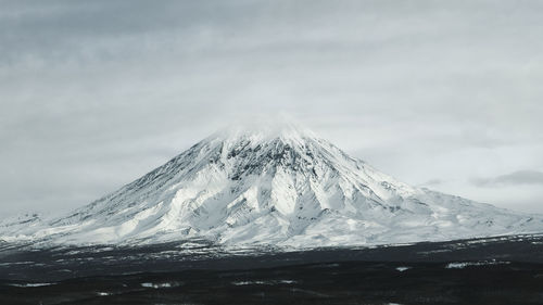 Scenic view of snowcapped mountain against sky