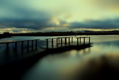 Scenic view of river against sky during sunset