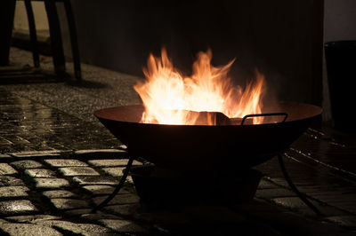 Wood burning in fire pit at yard