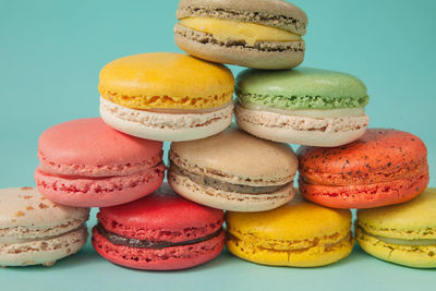 Close-up of multi colored candies against white background