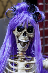 Halloween skeleton with wig and curlers