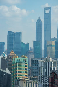 Modern buildings in city against sky