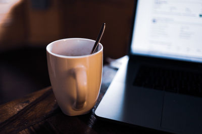 Close-up of coffee cup on table