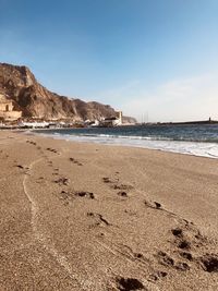 Scenic view of beach against clear sky