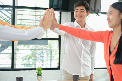 Business people joining hands