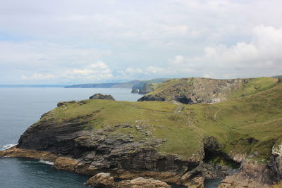 Scenic view of sea and rocks against sky