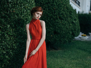 Portrait of a young woman standing outdoors