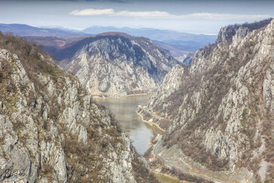 Scenic view of river amidst mountains