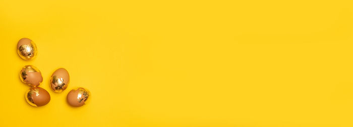 Directly above shot of candies on yellow background