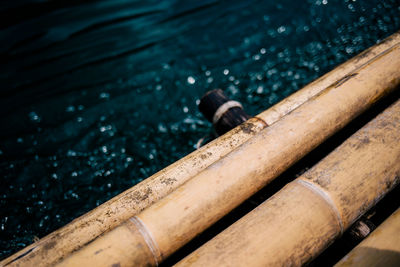 Close-up of wooden raft in lake