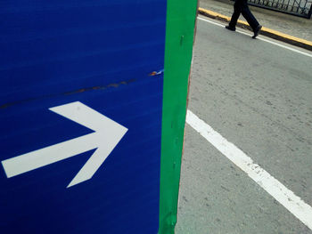 Close-up low section of people on blue background