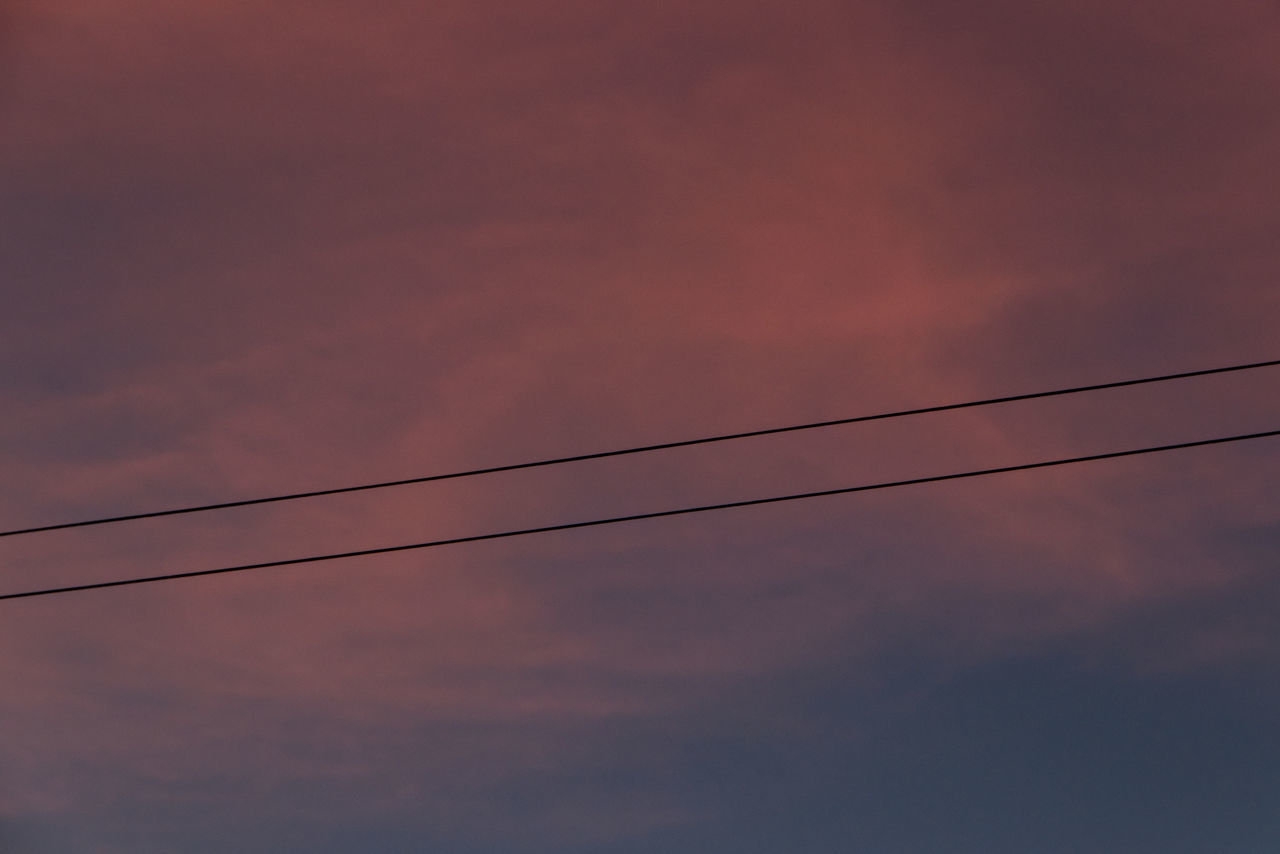 LOW ANGLE VIEW OF SILHOUETTE POWER LINES AGAINST SKY AT SUNSET