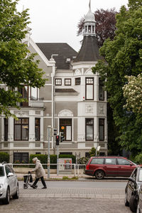 View of buildings along trees