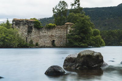 View of castle on riverbank