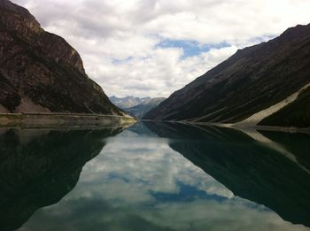 Scenic view of lake and mountains against sky