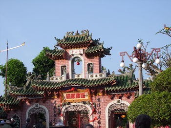 Low angle view of phuoc kien assembly hall against sky on sunny day