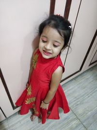 High angle view of smiling girl at home