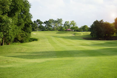 View of golf course against sky