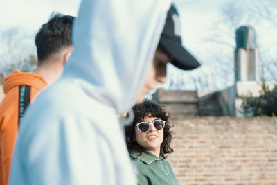 Crew of young people walking together in the street