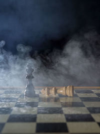 Close-up of chess pieces on table