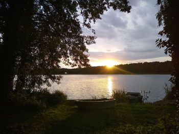 Scenic view of lake against sky during sunset